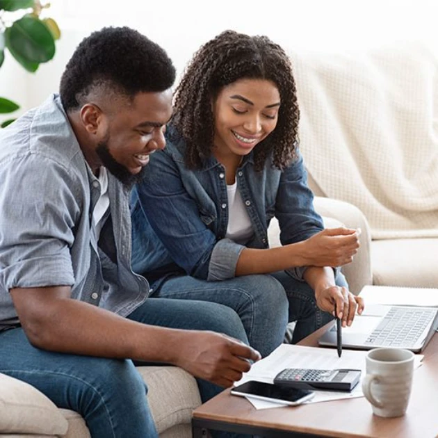 Couple Looking Over Mortgage Proposal