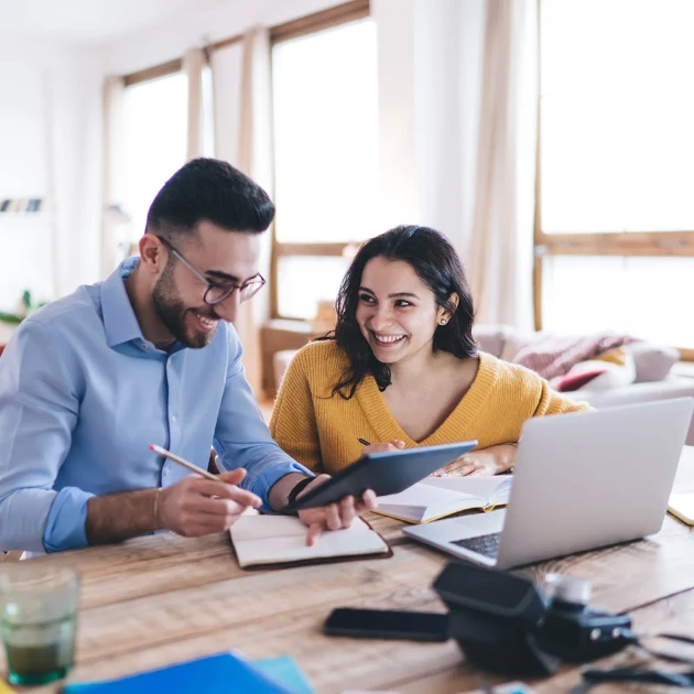 Couple looking at a laptop